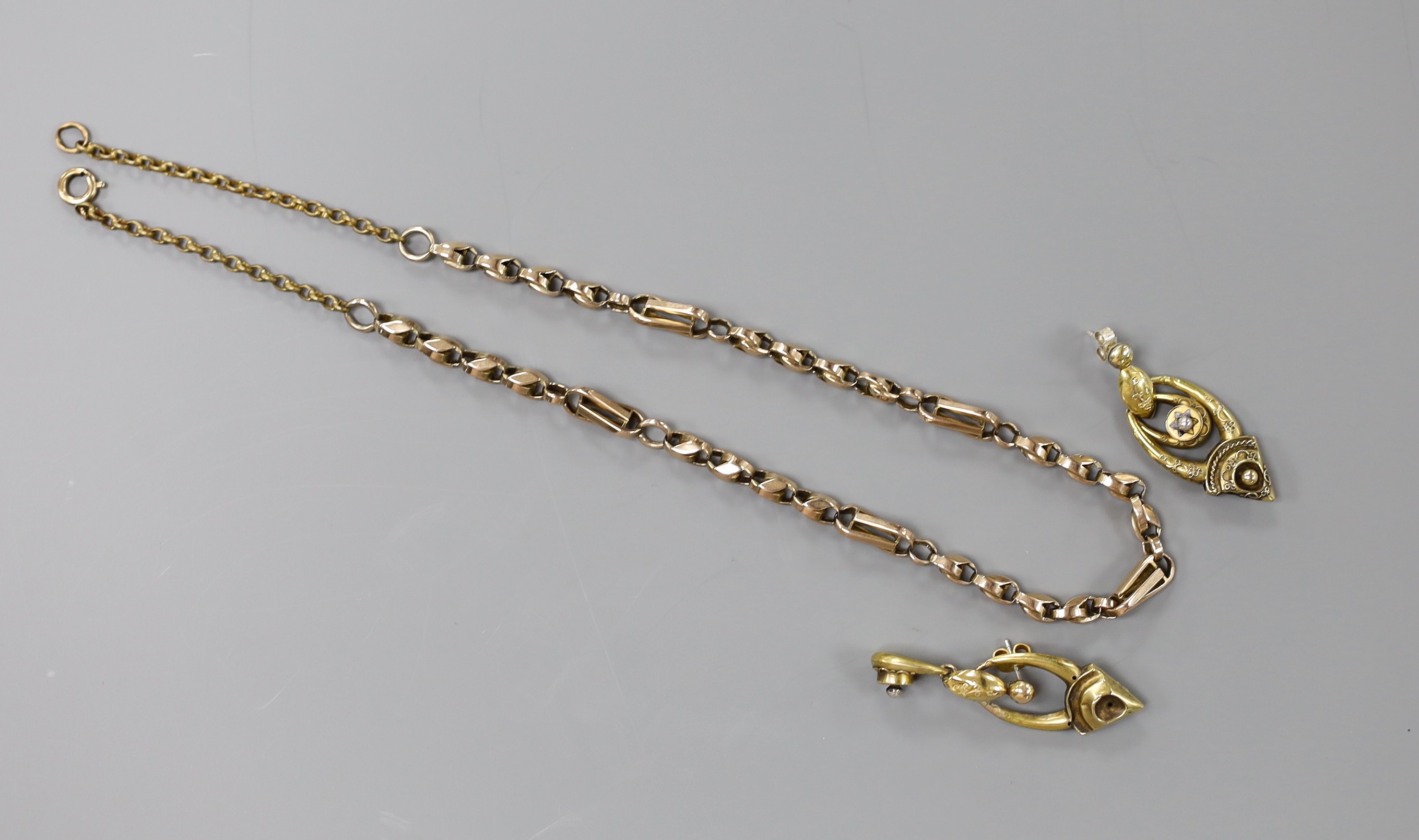 An early 20th century yellow metal necklace with gilt metal extensions, 43cmm gross 13.9 grams, together with a pair of Victorian yellow metal and black enamel set drop earrings, 40mm, gross weight 4.5 grams.